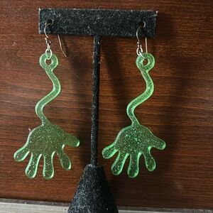 Green sticky hand toy earrings